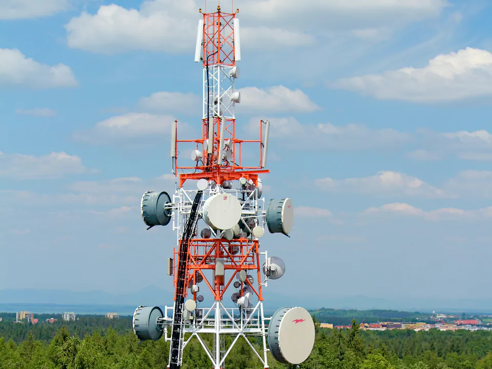 Telecommunication tower with antennas and microwave dishes