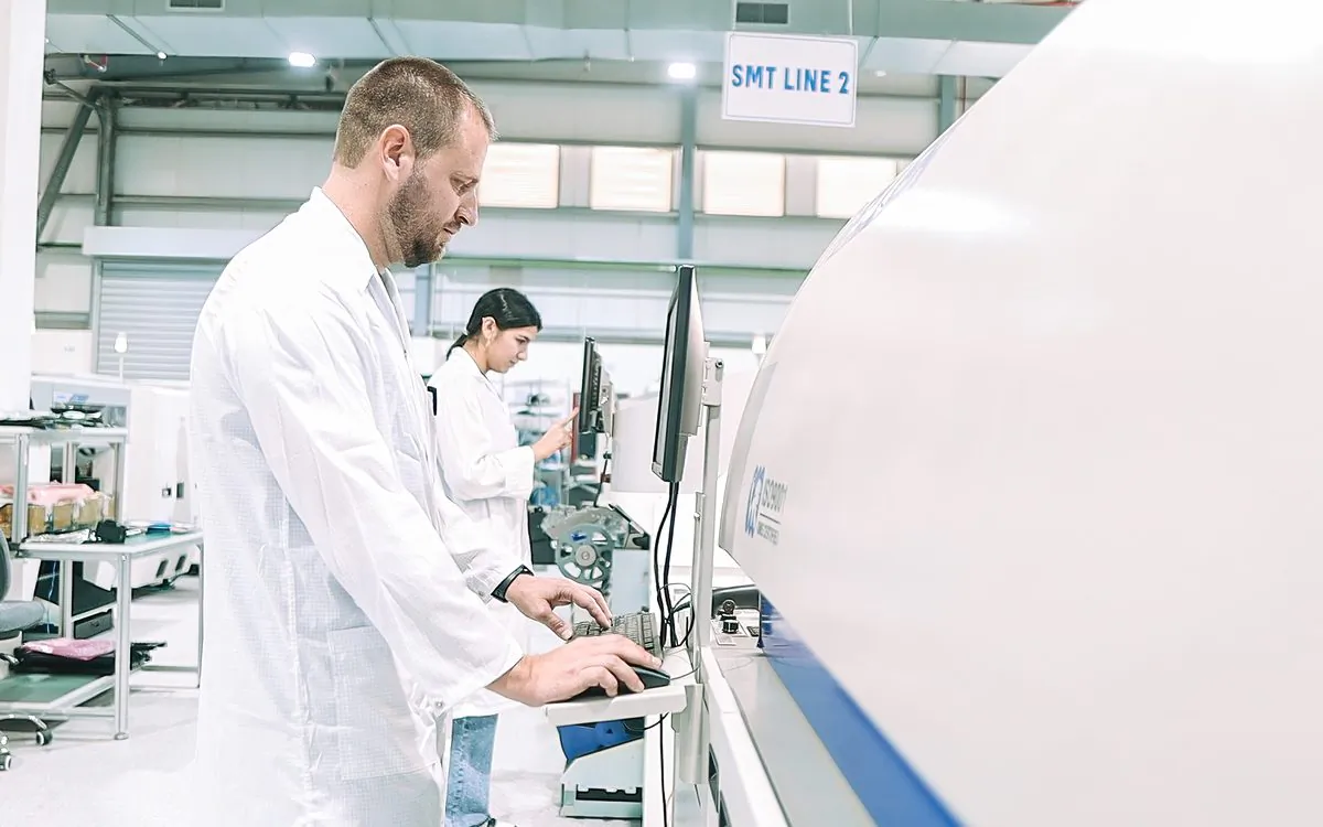 Engineer setting up an SMT line