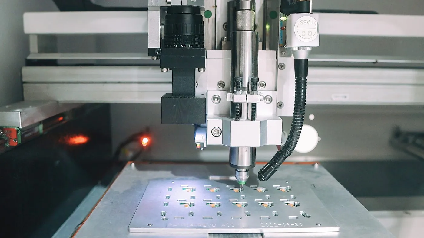 SMT pick-and-place head placing components on a PCB