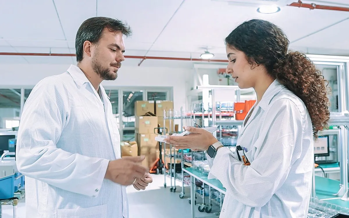 Engineers reviewing a production part together