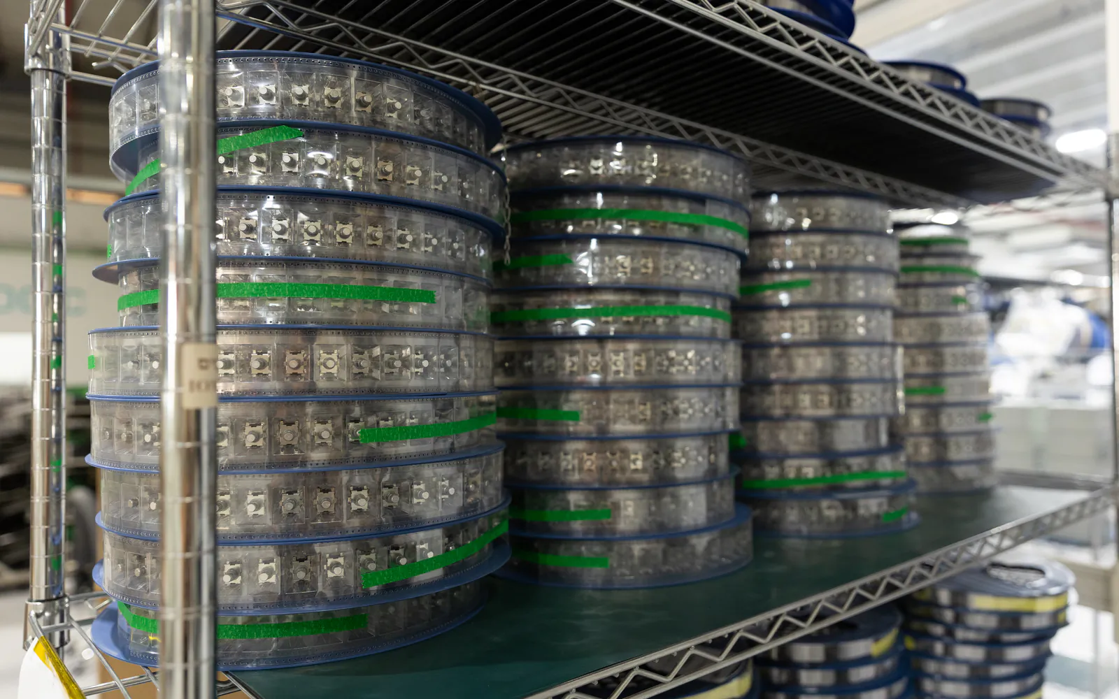 Component reels stocked on warehouse shelving